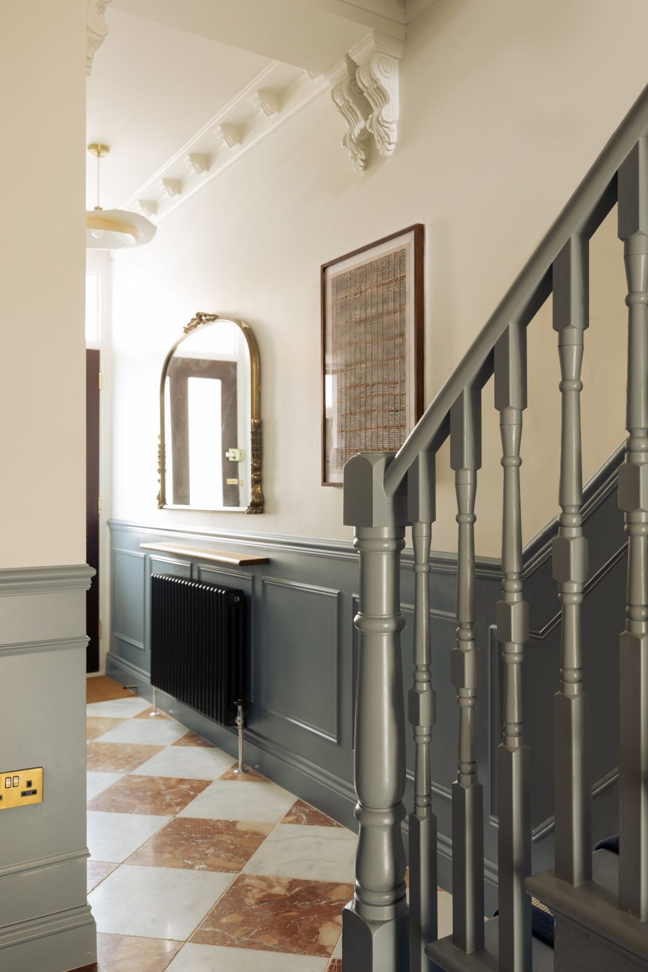 Ravenswood Road hallway with blue-grey panelling and painted staircase