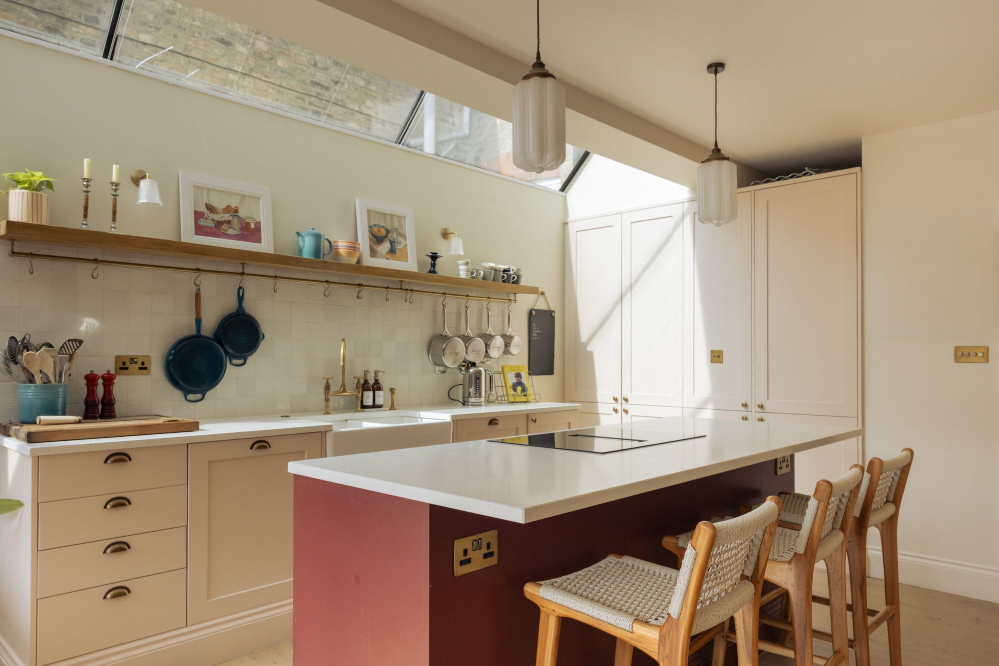 Kitchen with island and open shelving in the side return