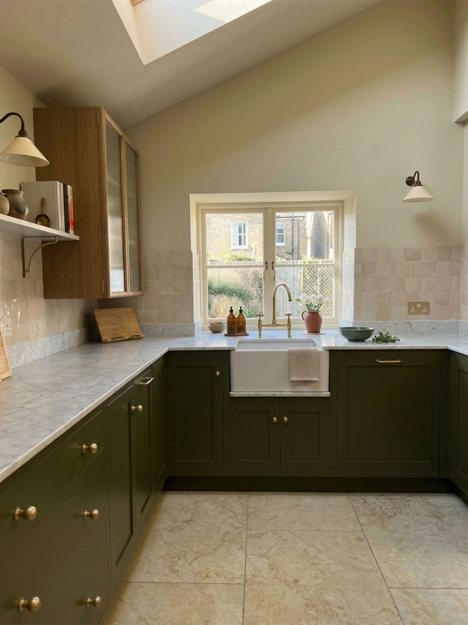 Rushdale Avenue kitchen with olive green cabinetry, marble worktops and a butler sink under the window