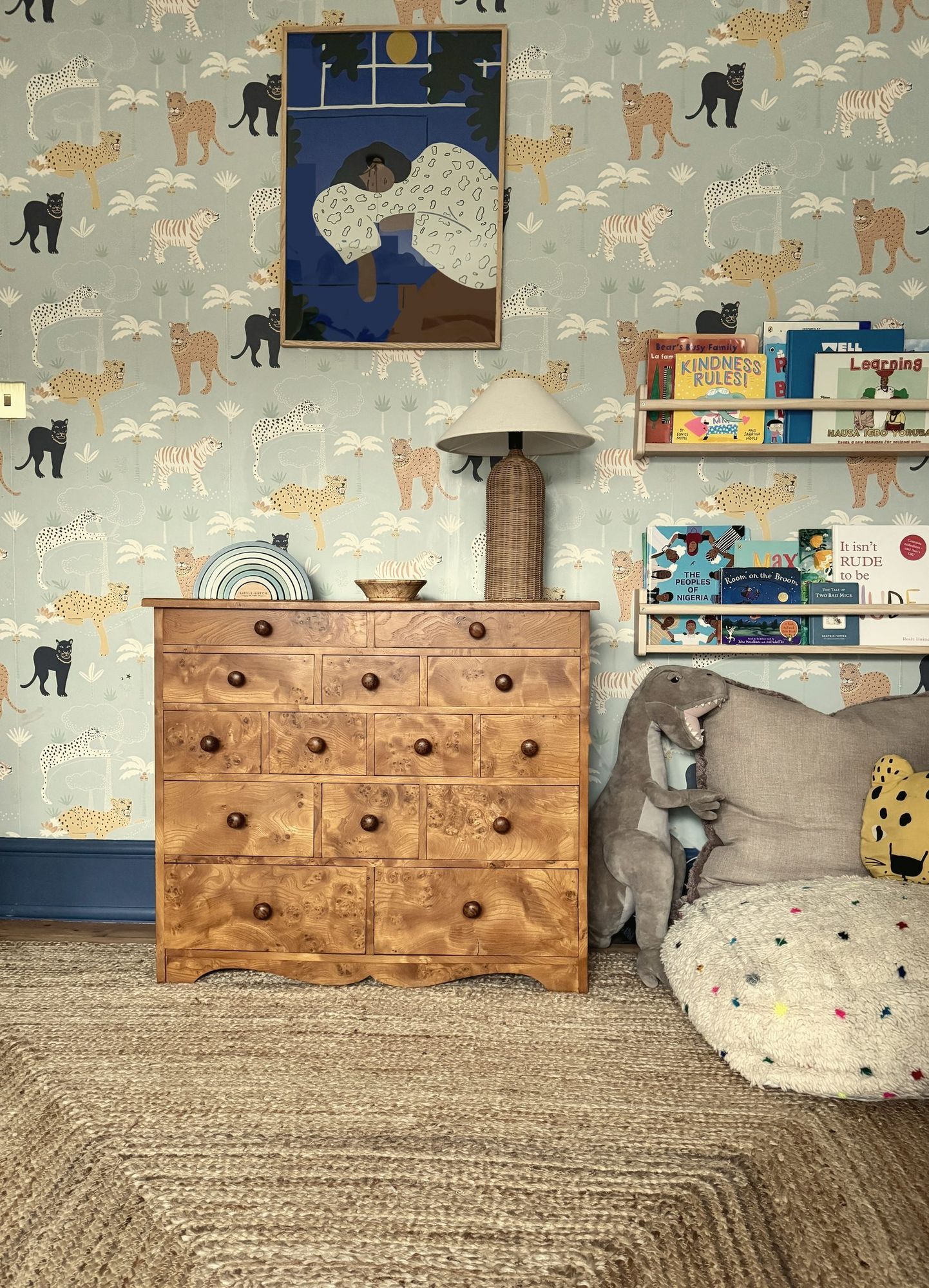 Child's bedroom with animal wallpaper and burr wood chest